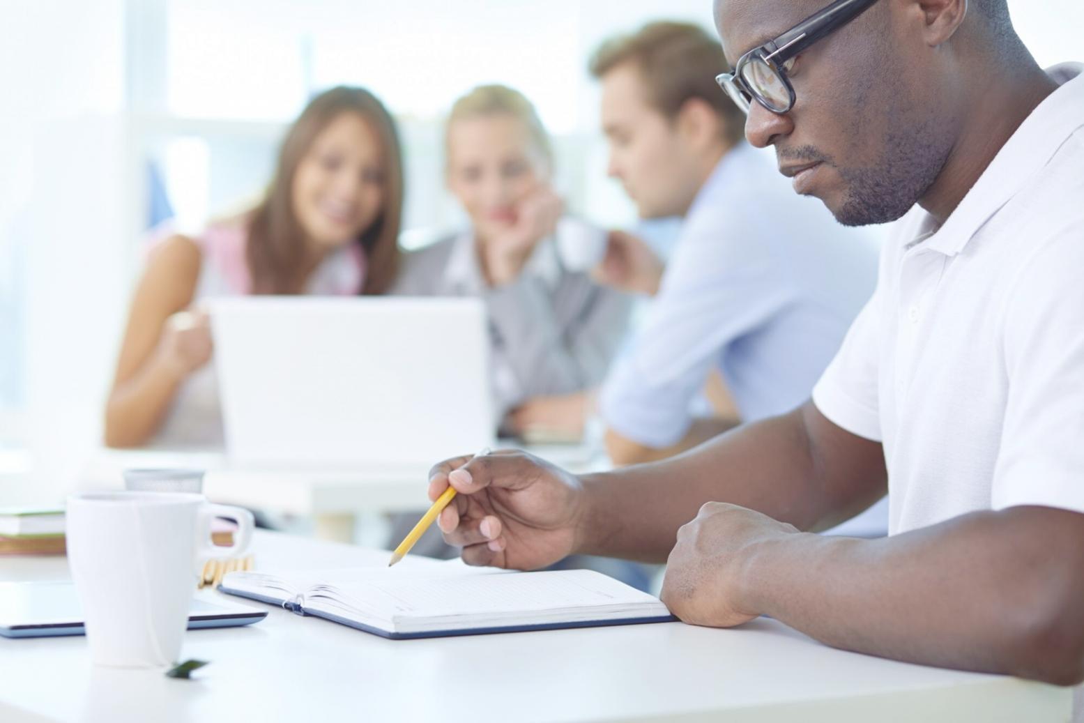 Family reviewing investment portfolio together at kitchen table